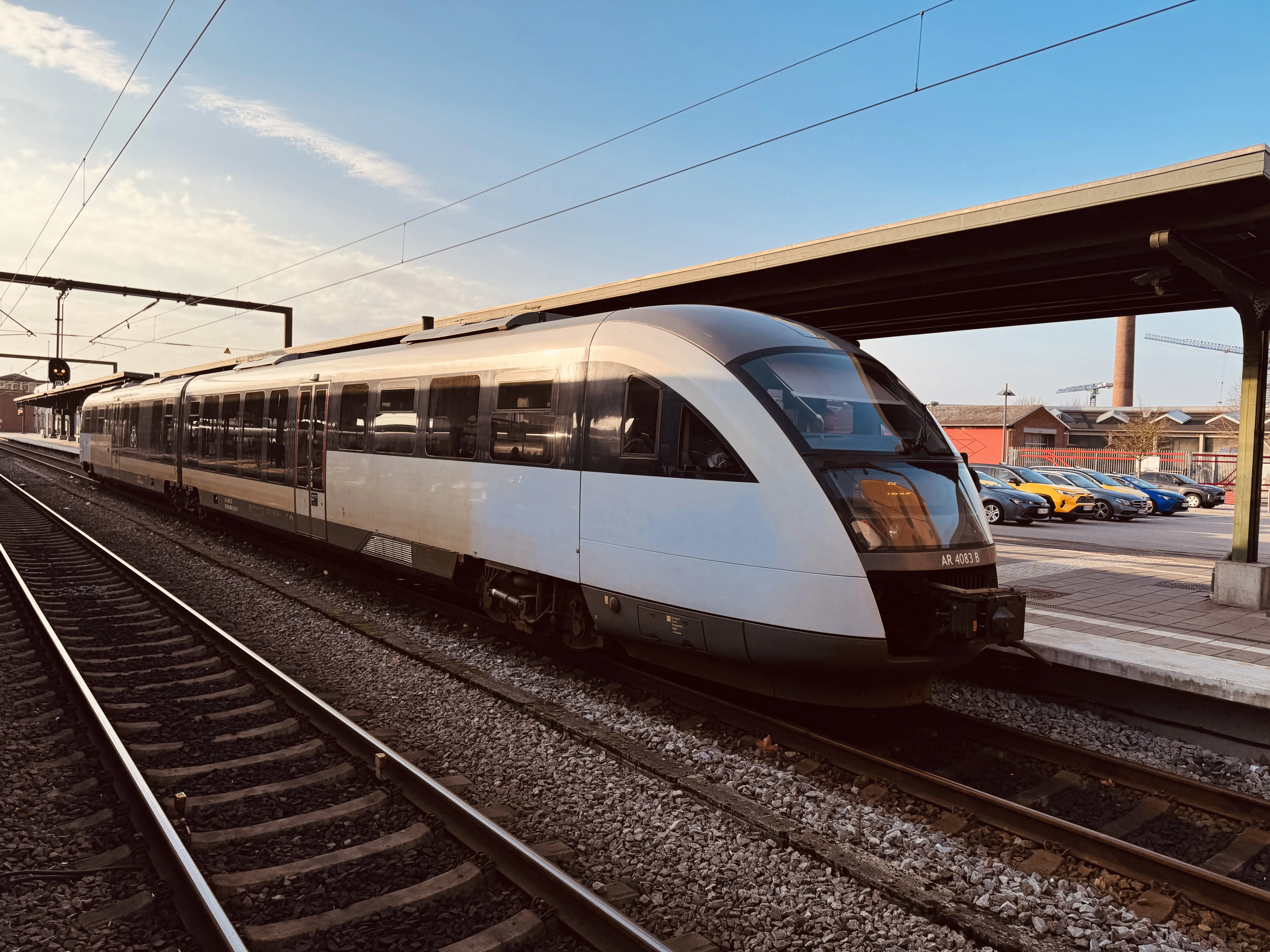 Billede af ARRIVA AR 4083, tidligere DSB MQ 4123-4923 fotograferet ud for Odense Banegård Center.